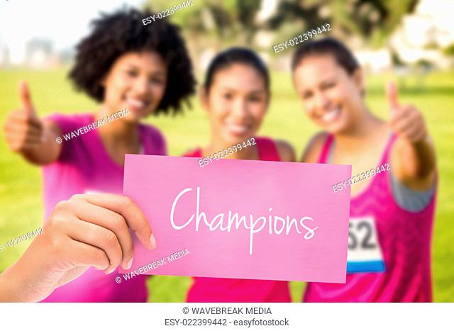 Champions against three smiling runners supporting breast cancer marathon
