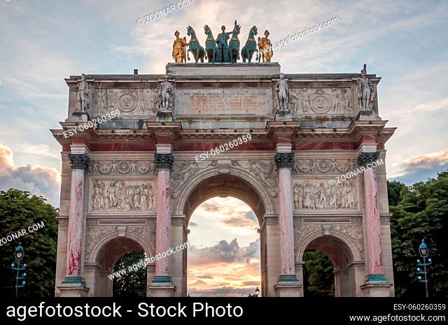 Sunset landscape on the Louvre Arch of Triumph in the Tuileries Garden in Paris