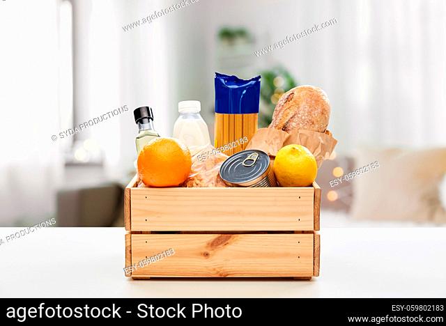 food in wooden box on table at home