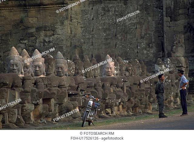 angkor, buddhas, cop, motorcycle, row, carved