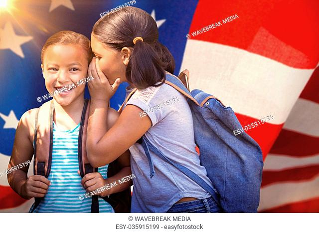 Composite image of girl with backpack whispering in friend ear