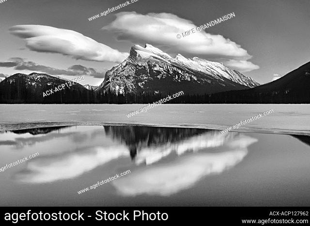 clouds and Mt. Rundle reflected in Vermillion Lakes at sunset Banff National Park Alberta Canada