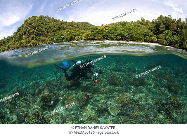 Underwater Photographer at shallow Reef, Gangga Island, North Sulawesi, Indonesia