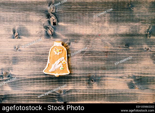 Christmas background, winter holidays, New Year party, celebration concept. Festive gingerbread on wooden background, greeting card template with copy space