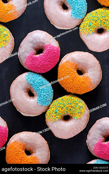Chocolate glazed donuts and sprinkle donuts