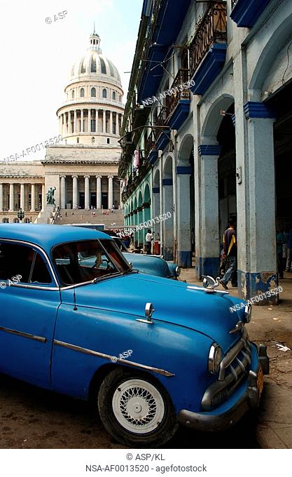 Side profile of a vintage car parked on a street, Havana, Cuba