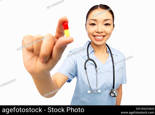 asian doctor with medicine and glass of water