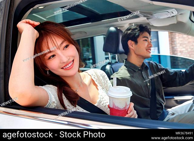 Young couples in the car