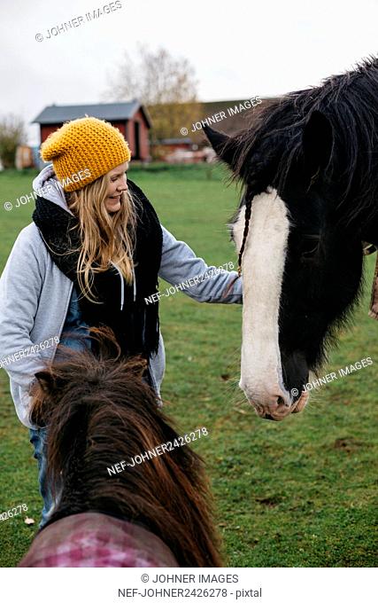 Teenage girl with horse