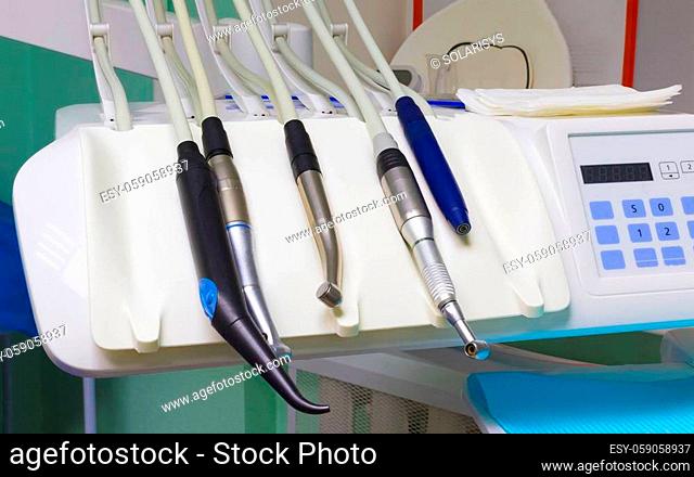 Different dental instruments and tools in a abstract dentists office