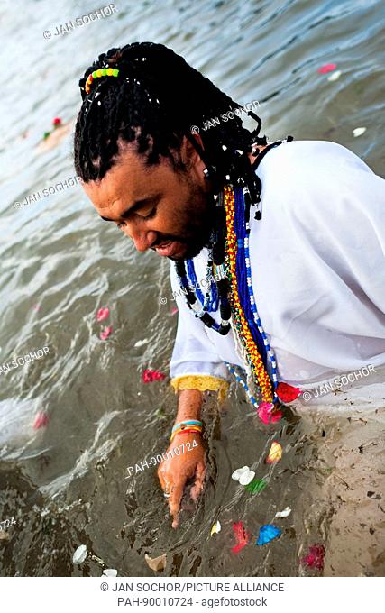 A Cadomblefaithful becomes possessed in the water during the festival of Yemanya, the goddess of the sea, in Salvador, Bahia, Brazil, 2 February 2012