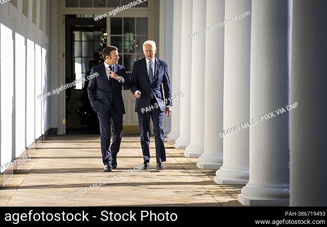 United States President Joe Biden with President Emmanuel Macron walk down the Colonnade to an Oval Office at the White House, Thursday, Dec. 1, 2022
