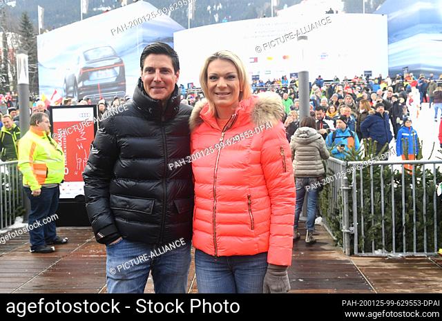 25 January 2020, Austria, Kitzbühel: Former ski racer Maria Höfl-Riesch and her husband Marcus Höfl show up in the finish area of the Hahnenkamm race before the...