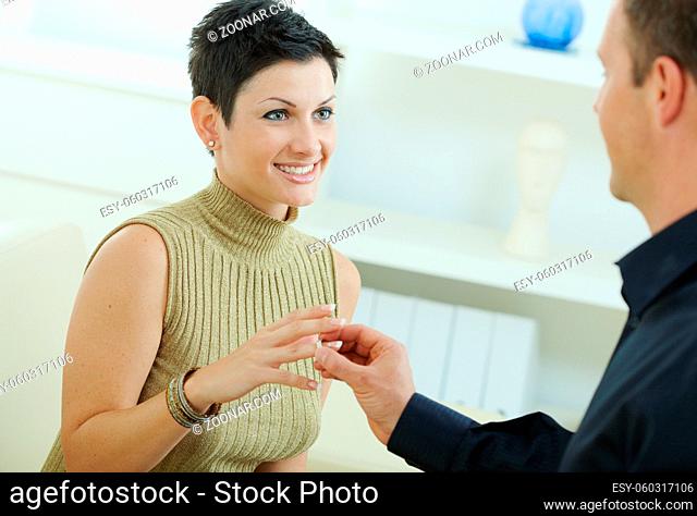 Man making a proposal giving engagement ring to her fiencee