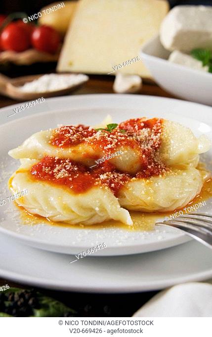 Culurgiones, Tortelli with cheese, potatoes, mint and tomato sauce, Italian gastronomy, Sardinia, Italy
