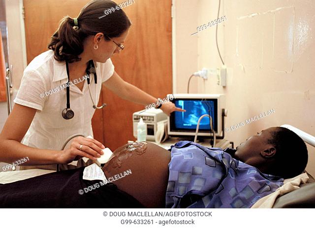 Danielle Haressema, left, a Canadian residency doctor, performs an ultrasound on a patient in the labour ward at the Howard Hospital in Zimbabwe