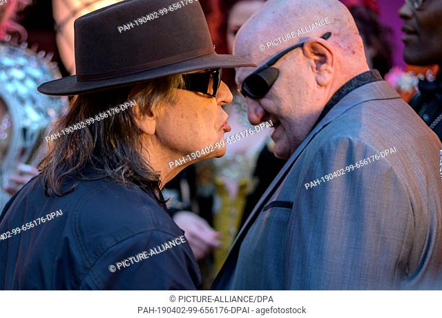 02 April 2019, Hamburg: Udo Lindenberg (l), singer and entertainer, and his former bodyguard, Eddy Kante, celebrate the opening of the burlesque nightclub ""The...