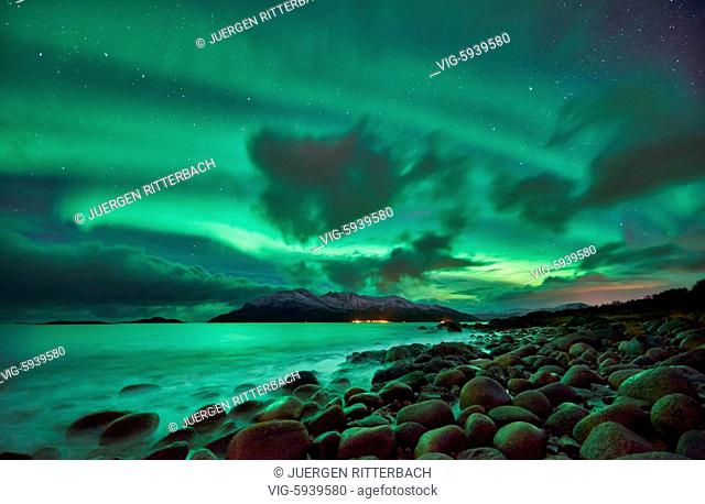 Aurora Borealis or northern lights over winter landscape in fjord of Kaldfjord, Tromvik, Tromso, Troms, Norway, Europe - Tromsoe, Troms, Norway, 28/10/2017