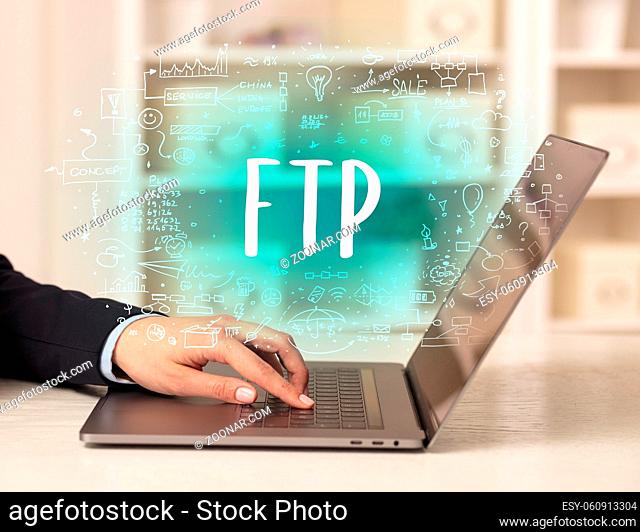 hand working on new modern computer with FTP abbreviation, modern technology concept
