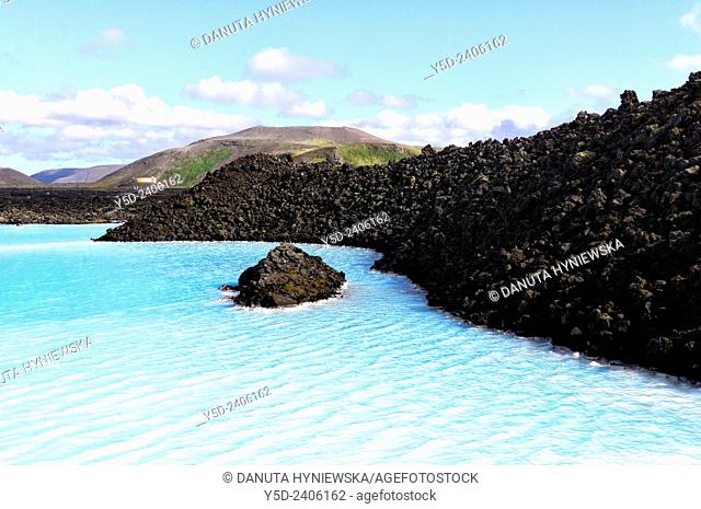 Icvelandic landscape, blue waters of Blue Lagoon mineral hot springs in contrast with black volcanic lava, , Grindavík close to Keflavik, Reykjanes Peninsula