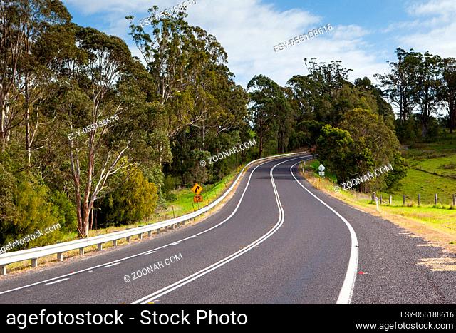 The Princes Highway winds around the countryside near Bega in New South Wales, Australia