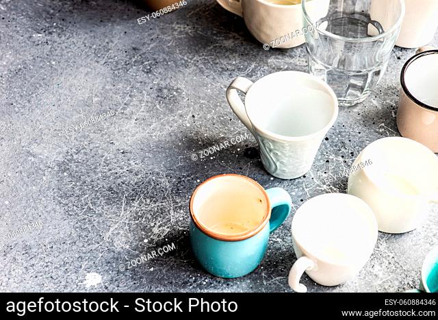 Various empty coffee cup on concrete background with copy space
