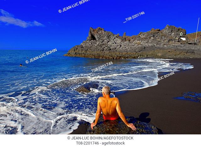 spain, canary islands, la palma : charco verde beach, bather