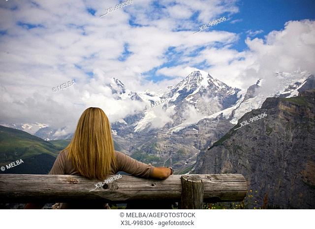 Woman comtemplating Monch mountain  Murren  Switzerland