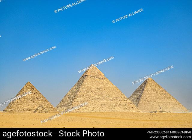 02 March 2023, Egypt, Giza: A general view of the Pyramids of Giza (L-R) Menkaure, Khafre, and Khufu, during the results announcement of the ScanPyramids...