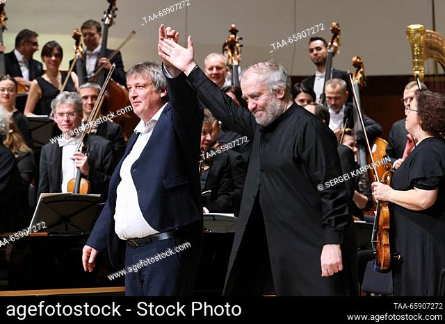 RUSSIA, MOSCOW - DECEMBER 19, 2023: Bolshoi Theatre head, Mariinsky Theatre general and artistic director, conductor Valery Gergiev (R) and pianist Boris...