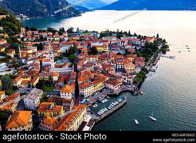 Italy, Province of Como, Menaggio, Helicopter view of town on shore of Lake Como at dawn
