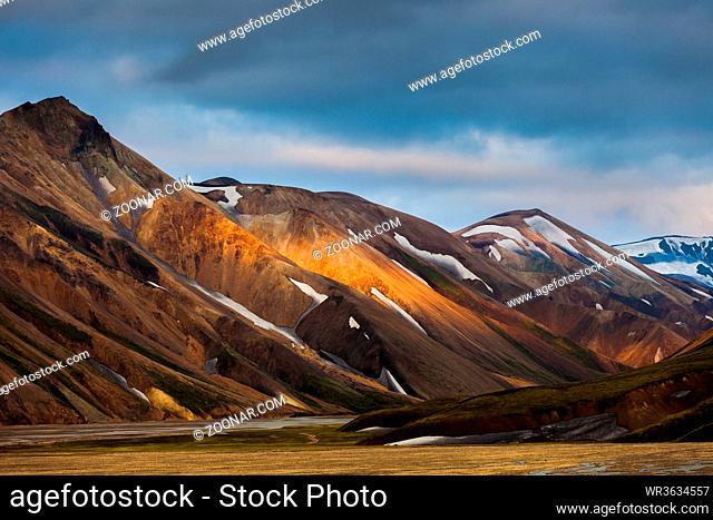 mountains and hills with blotches of snow in Landmannalaugar, Iceland