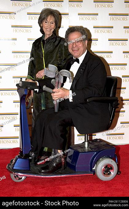 Itzhak Perlman and his wife, Toby, arrive at the Harry S. Truman Building (Department of State) in Washington, D.C. on December 4