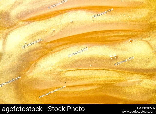 Abstract golden liquid background, paint splash, swirl pattern and water drops, beauty gel and cosmetic texture, contemporary magic art and science as luxury...