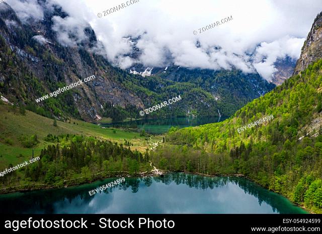 Scenic mountain panorama with green meadows and idyllic turquoise Lake Oberer Gaisalpsee on the hike to Nebelhorn Mountain, Oberstdorf, Bavaria, Germany