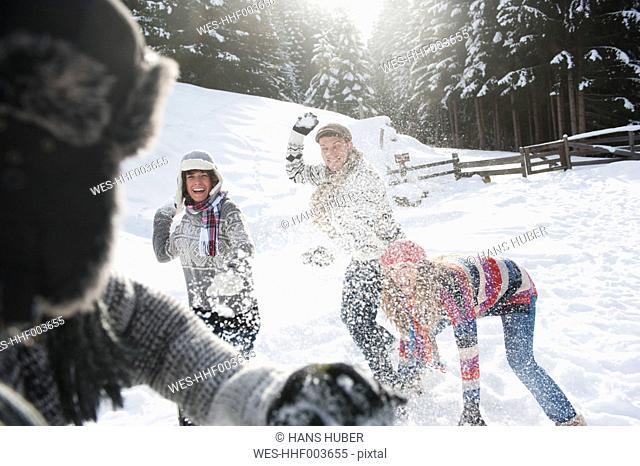Austria, Salzburg Country, Flachau, Young people snow fighting in snow