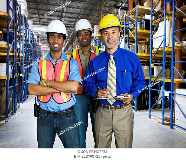 Multi-ethnic co-workers in warehouse