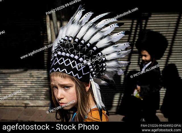 26 February 2021, Israel, Bnei Brak: A costumed Jewish child takes part in celebrations marking Purim, also called the Festival of Lots