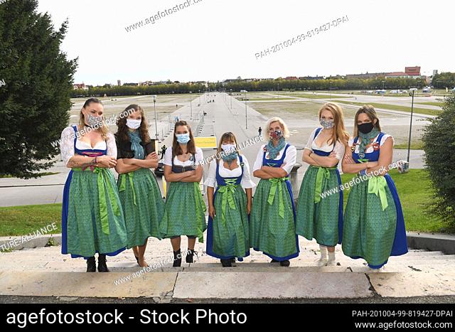 04 October 2020, Bavaria, Munich: The waitresses of the Hofbräuzelt Nadine Lindenmeier, (l-r), Sabrina Schneider, Daniela Schneider, Milena Gebhardt