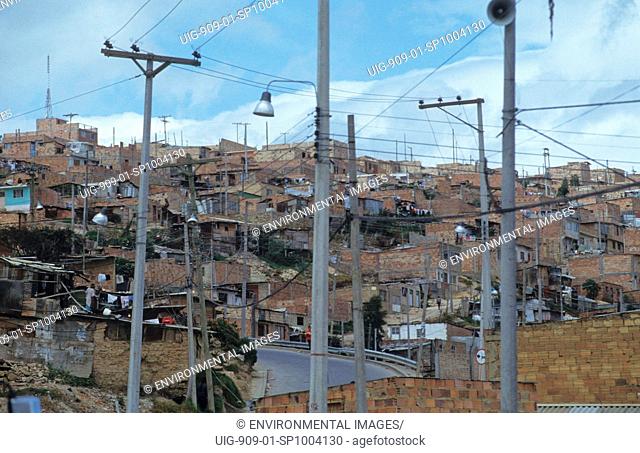 SLUM, COLOMBIA. Bogota. Poor barrio in Bogota, showing recently installed electricity and telephone lines.