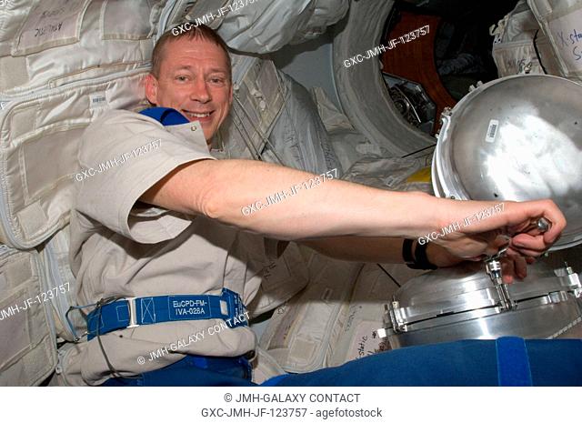 European Space Agency astronaut Frank De Winne, Expedition 20 flight engineer, performs the regular service on the Water Processor Assembly (WPA) in the Kibo...