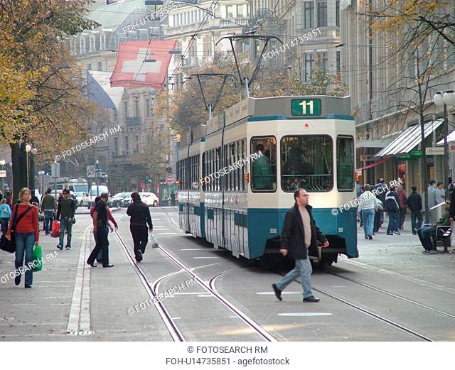 Switzerland, Europe, Zurich, Zuerich, downtown, Bahnhofstrasse, trolley, tram, commuters