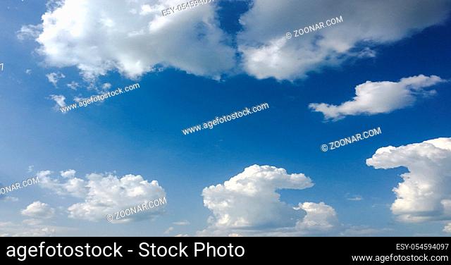 Beautiful clouds against a blue sky background. Cloud sky. Blue sky with cloudy weather, nature cloud. White clouds, blue sky and sun