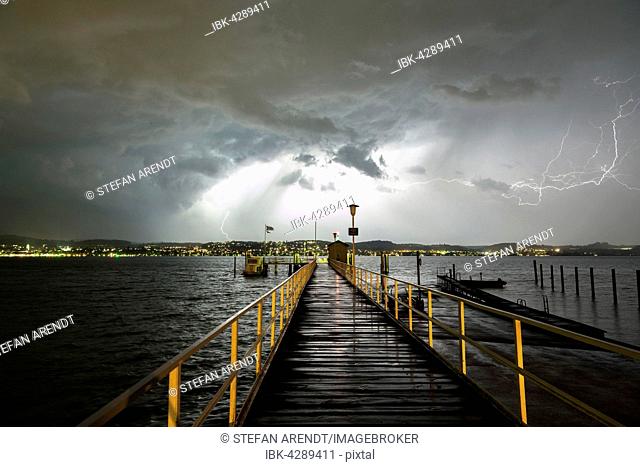 Thunderstorm with thunderbolt, jetty on Lake Constance, Dingelsdorf, rear Ueberlingen, Baden-Württemberg, Germany