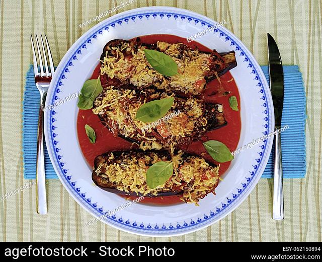 Stuffed aubergines with surimi, seafood and cheese