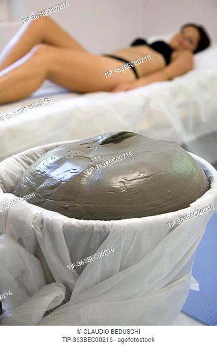Woman at spa before having clay treatment