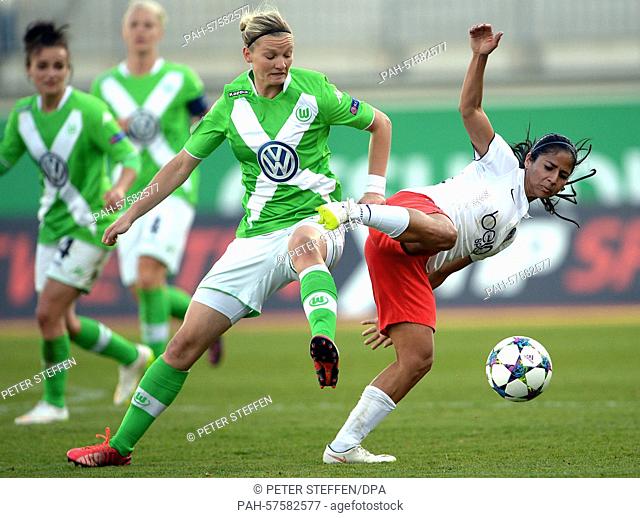 Wolfsburg's Alexandra Popp (M) and St. Germain's Shirley Cruz Trana (r) compete for the ball during the first leg of the Women's Champions League semi-final at...