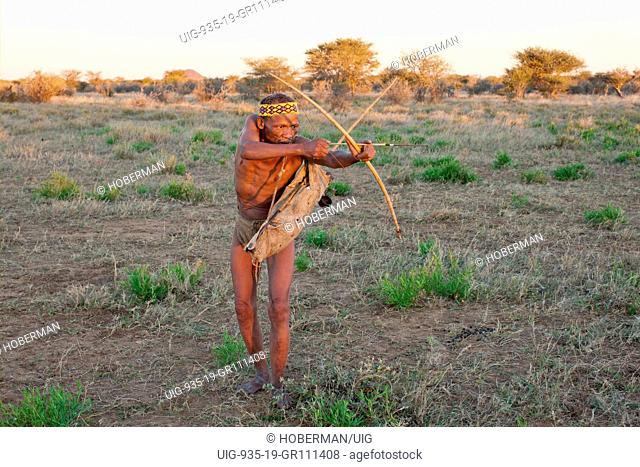 Traditional bushmen with traditional clothes and weapons