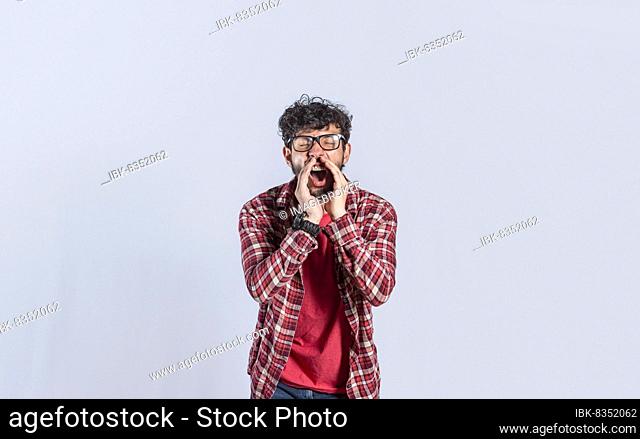 A person announcing and yelling, Handsome man in glasses shouting an announcement, isolated. concept of a guy yelling an announcement