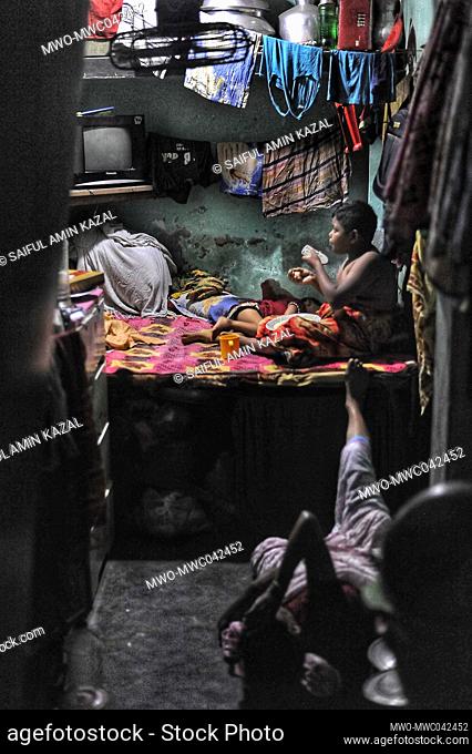 Life as a Bihari. Children on bed in thier tiny shack. ‘Biharis’ refers to the approximately 300, 000 non-Bengali citizens of the former East Pakistan who...